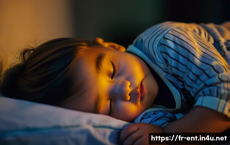 아데노이드 비대 진단과 치료 병원 - A close-up of a young child, approximately 4-6 years old, sleeping restlessly in their bed at night....